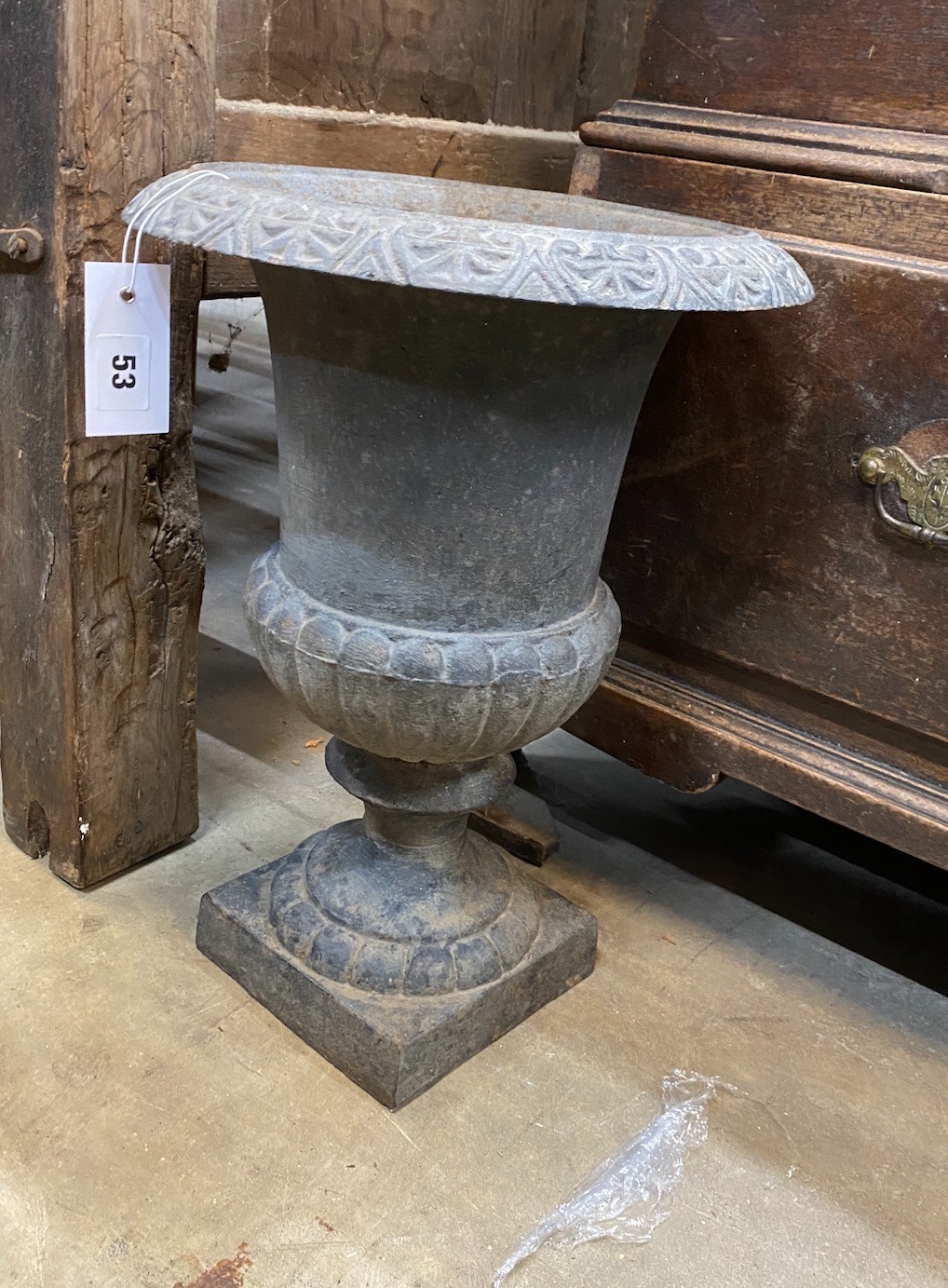 A cast iron circular campana garden urn, diameter 30cm, height 43cm